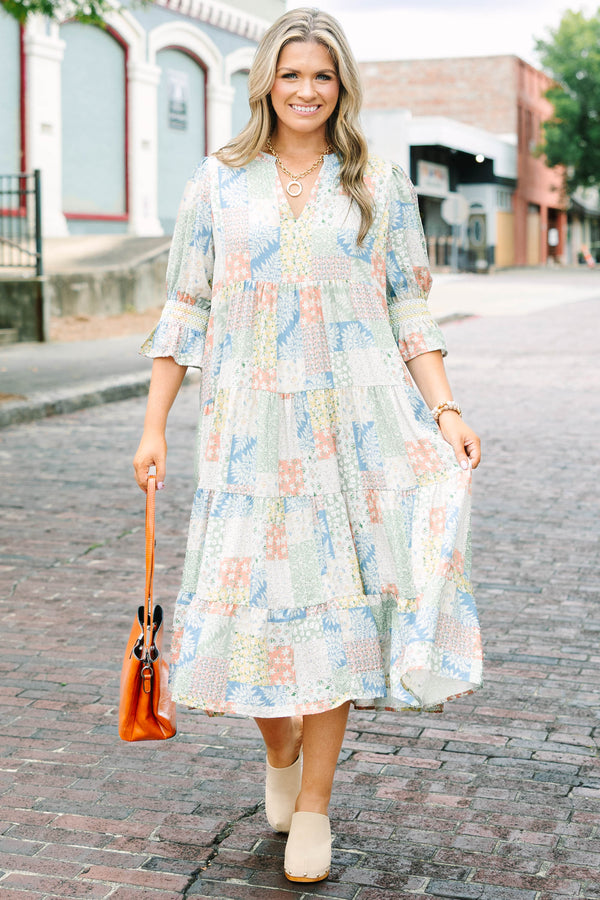 Plus size multi-color patchwork print midi dress with a flowy tiered skirt and v-neckline.