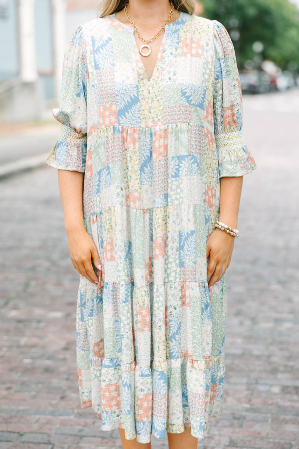 Plus size multi-color patchwork print midi dress with a flowy tiered skirt and v-neckline.