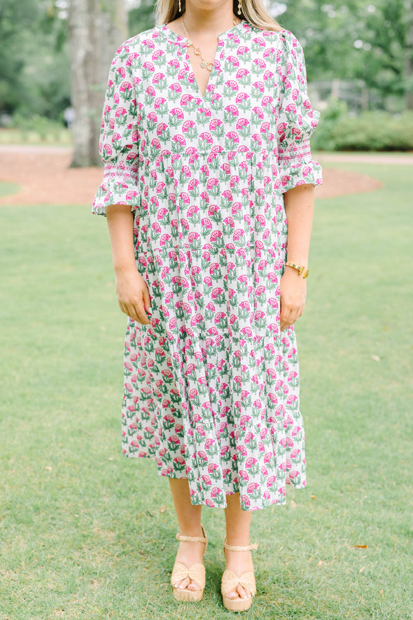 Plus Size pink floral tiered midi dress with puff sleeves and a V-neckline.