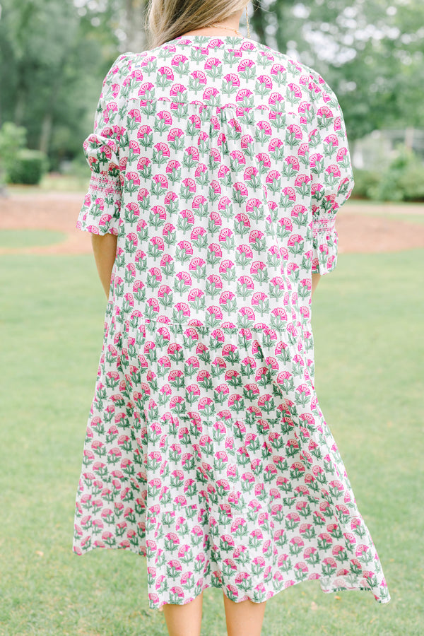 Plus Size pink floral tiered midi dress with puff sleeves and a V-neckline.