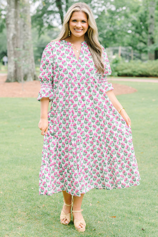 Plus Size pink floral tiered midi dress with puff sleeves and a V-neckline.