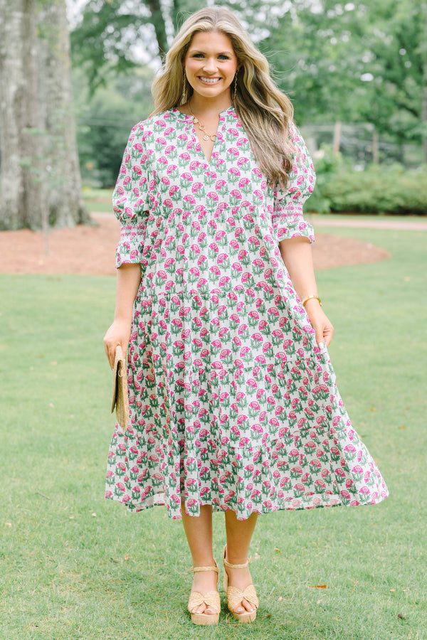 Plus Size pink floral tiered midi dress with puff sleeves and a V-neckline.