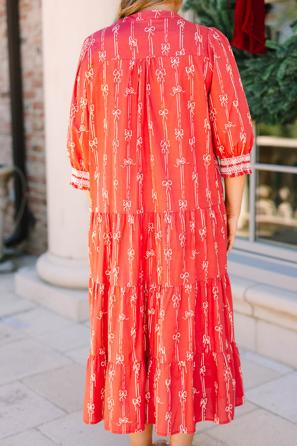 Plus size red bow print midi dress with a tiered skirt, v-neckline, and flowy cotton fit.