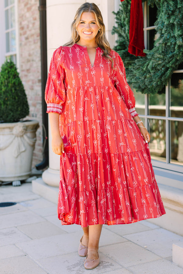 Plus size red bow print midi dress with a tiered skirt, v-neckline, and flowy cotton fit.