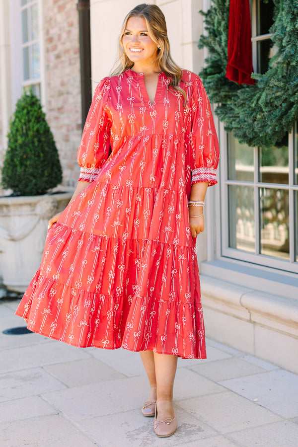 Plus size red bow print midi dress with a tiered skirt, v-neckline, and flowy cotton fit.