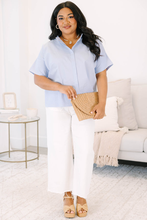 Plus size light blue cotton poplin button-down top with elbow-length sleeves.