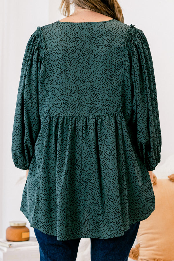 Chic Soul plus size clothing, dark green long top with three quarter inch sleeves and a black polka dot pattern throughout 
