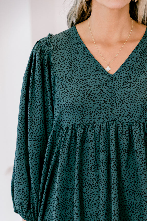 Chic Soul plus size clothing, dark green long top with three quarter inch sleeves and a black polka dot pattern throughout 

