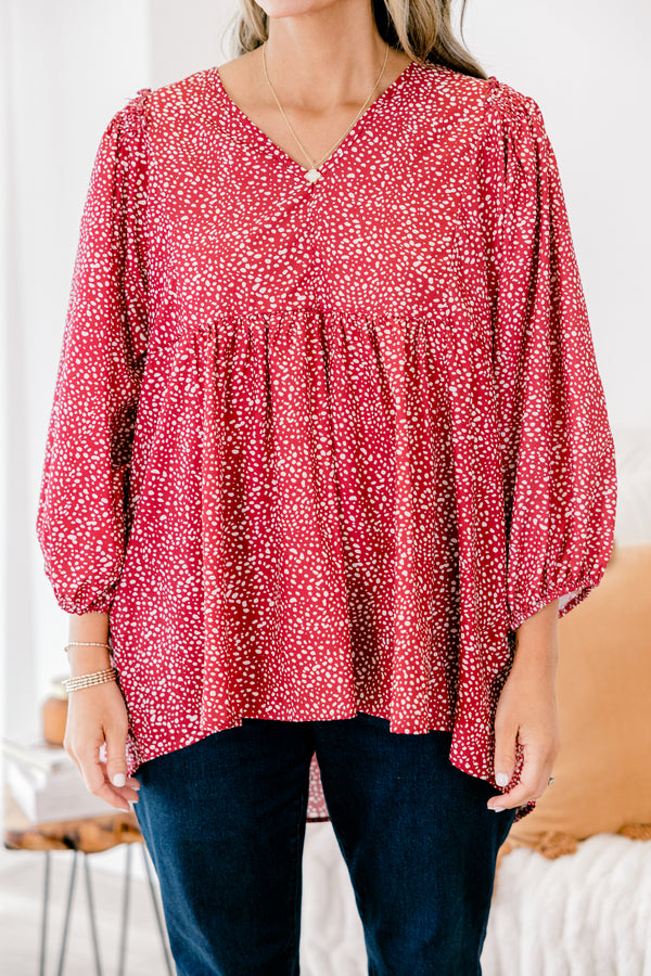 Chic Soul plus size clothing, red long sleeve babydoll top with a slight v-neckline and a white polka dot pattern throughout