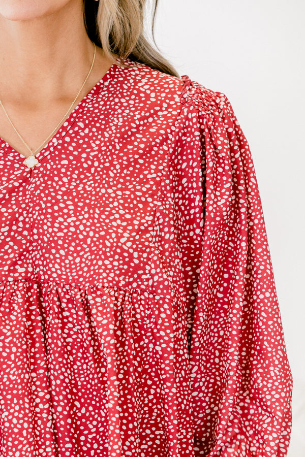 Chic Soul plus size clothing, red long sleeve babydoll top with a slight v-neckline and a white polka dot pattern throughout