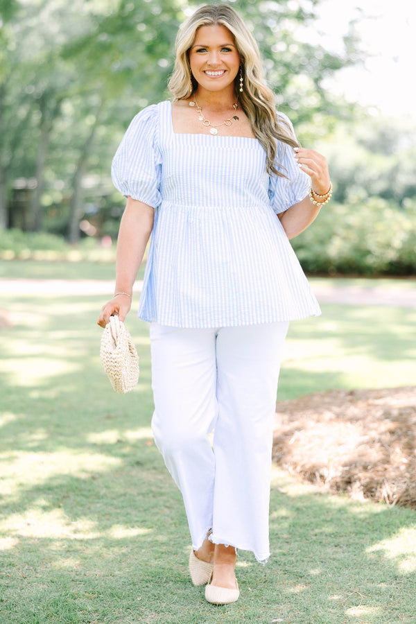 Plus Size blue and white striped seersucker top with puff sleeves and a square neckline.
