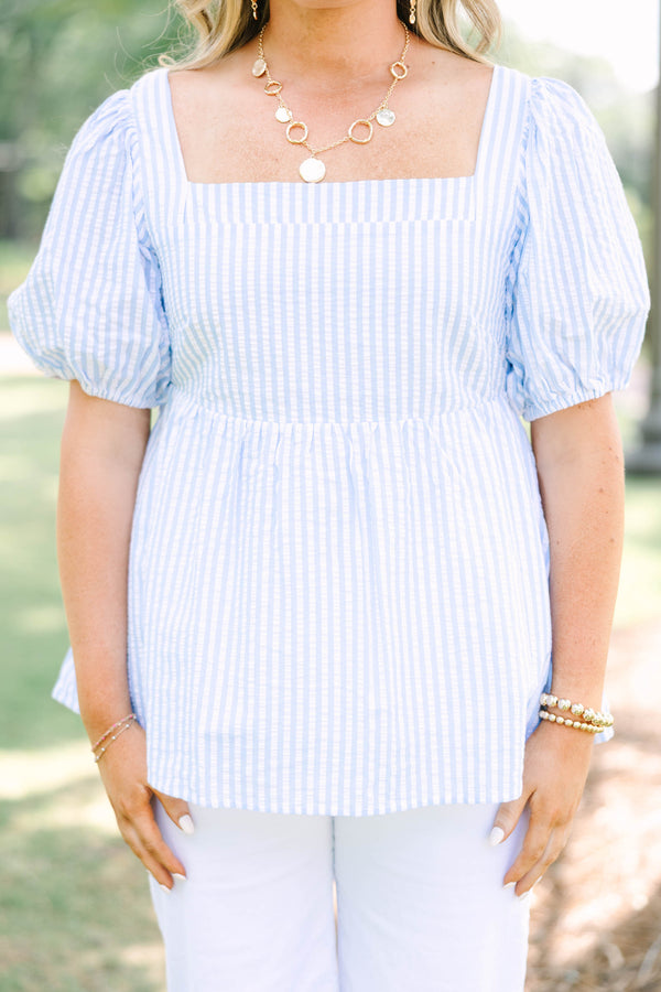 Plus Size blue and white striped seersucker top with puff sleeves and a square neckline.