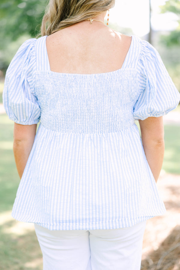 Plus Size blue and white striped seersucker top with puff sleeves and a square neckline.