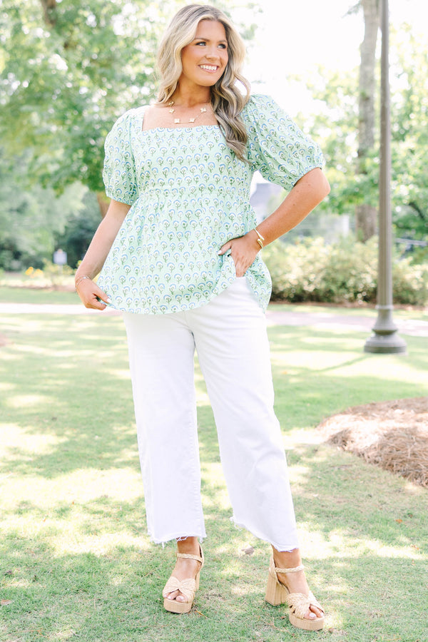 Plus Size green floral print top with a square neckline, puff sleeves, and a peplum waist.