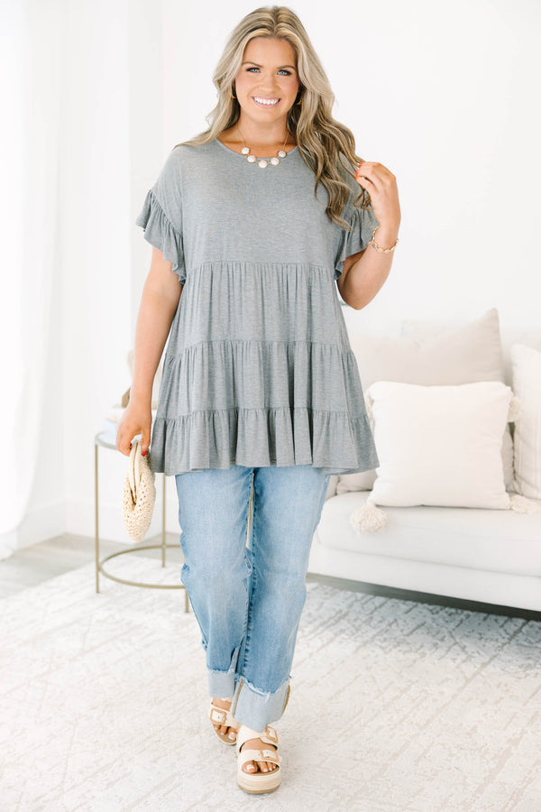 Plus Size charcoal grey tiered tunic with ruffled short sleeves and a flowy, relaxed fit.