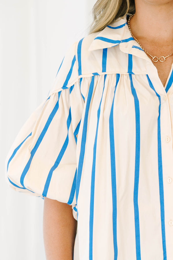 Plus size cream and blue striped button-up blouse with flowy bubble sleeves and a relaxed fit.