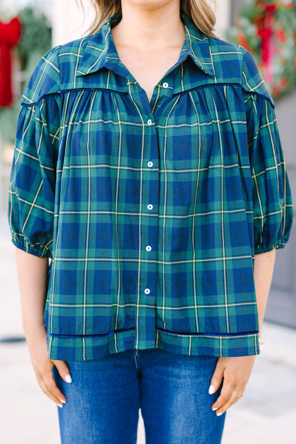 Plus size green plaid blouse with a flowy fit, button-down front, and classic collar.