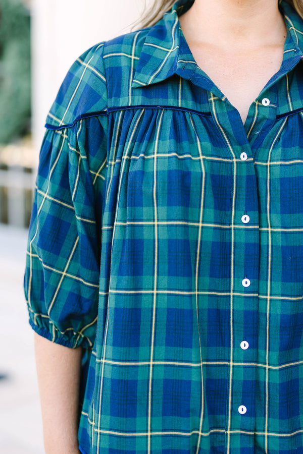 Plus size green plaid blouse with a flowy fit, button-down front, and classic collar.