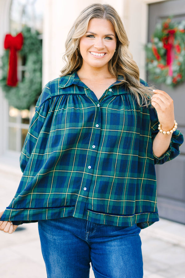 Plus size green plaid blouse with a flowy fit, button-down front, and classic collar.