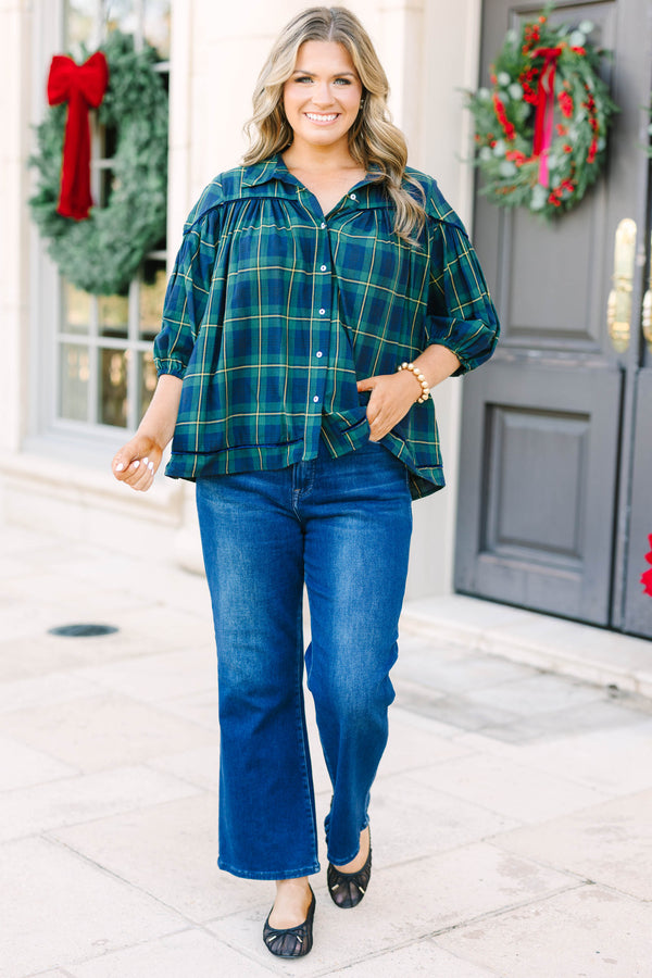 Plus size green plaid blouse with a flowy fit, button-down front, and classic collar.
