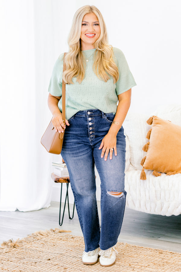 Chic Soul plus size clothing, Dark wash distressed jeans with a whole on the left knee and buttons instead of a zipper 