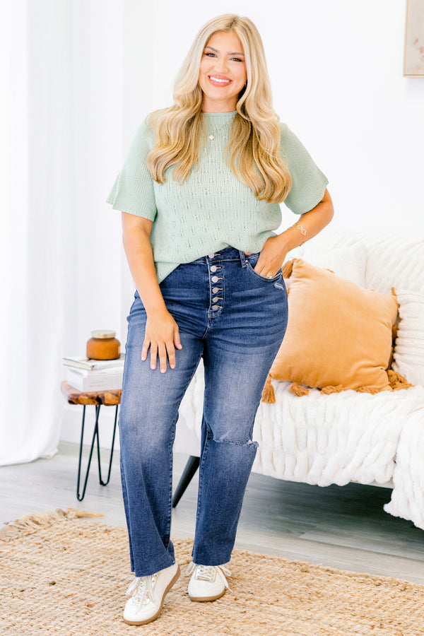 Chic Soul plus size clothing, Dark wash distressed jeans with a whole on the left knee and buttons instead of a zipper 