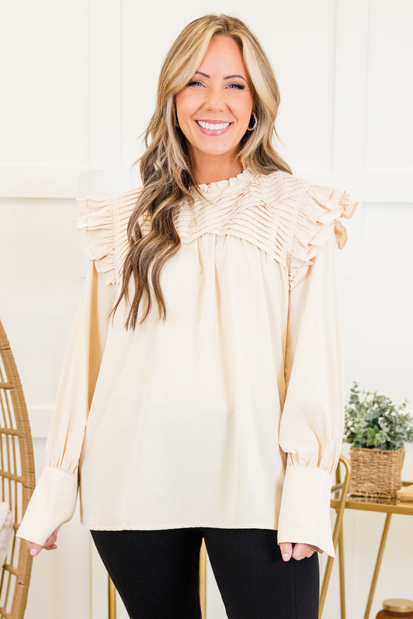 Chic Soul plus size clothing, cream long sleeve top with ribbed layered detail along chest with ruffle flare on shoulders with cuff sleeves
