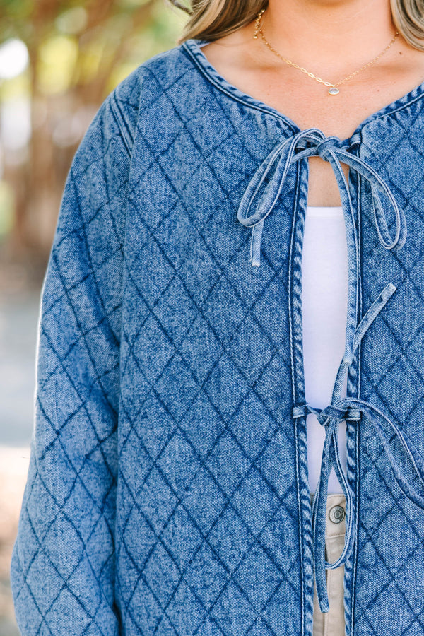 Plus Size quilted denim jacket with a diamond pattern, tie-front closures, and long sleeves.