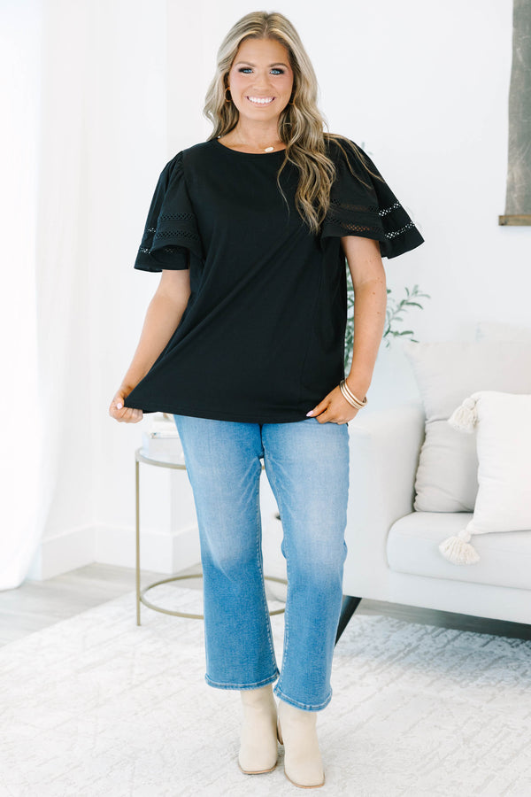 Plus size black 100% cotton top with flowy ruffle sleeves and crochet lace detailing.