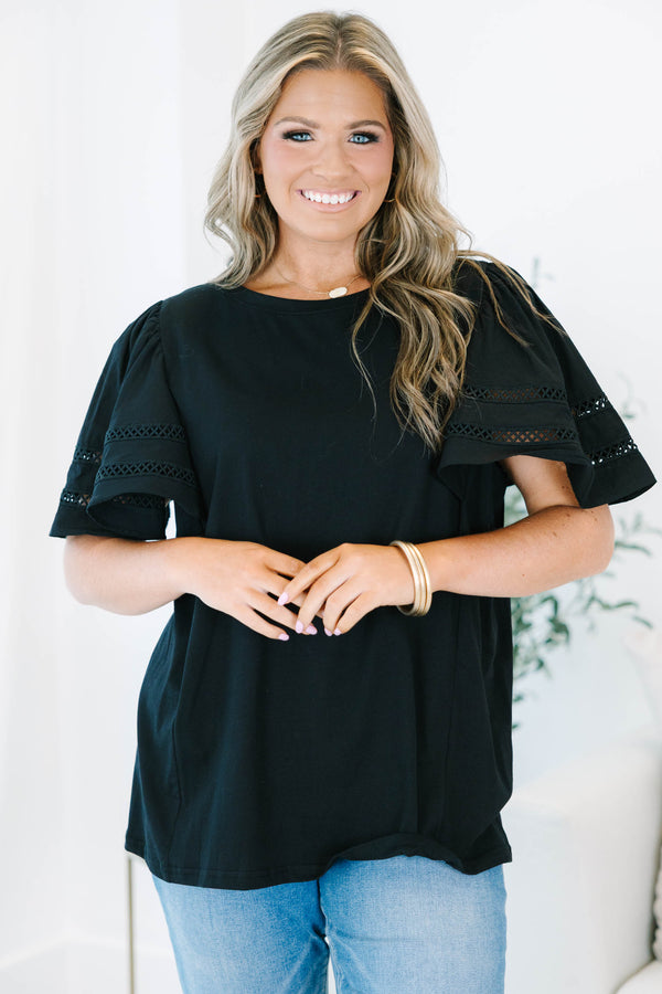 Plus size black 100% cotton top with flowy ruffle sleeves and crochet lace detailing.
