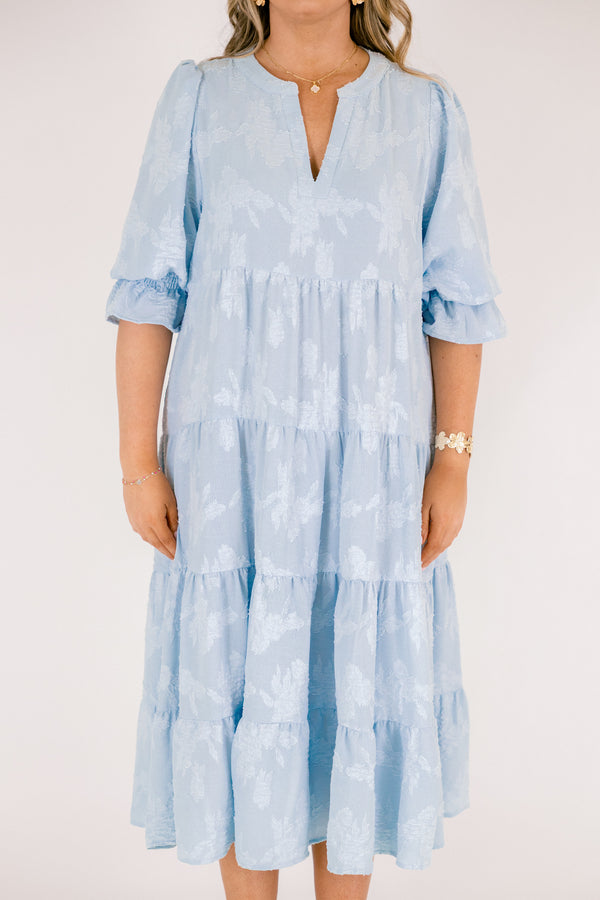 Chic Soul plus size clothing, baby blue tiered midi dress with half sleeves that that have a ruffle detail at the end of each sleeve as well a slight v-neckline and subtle floral pattern 