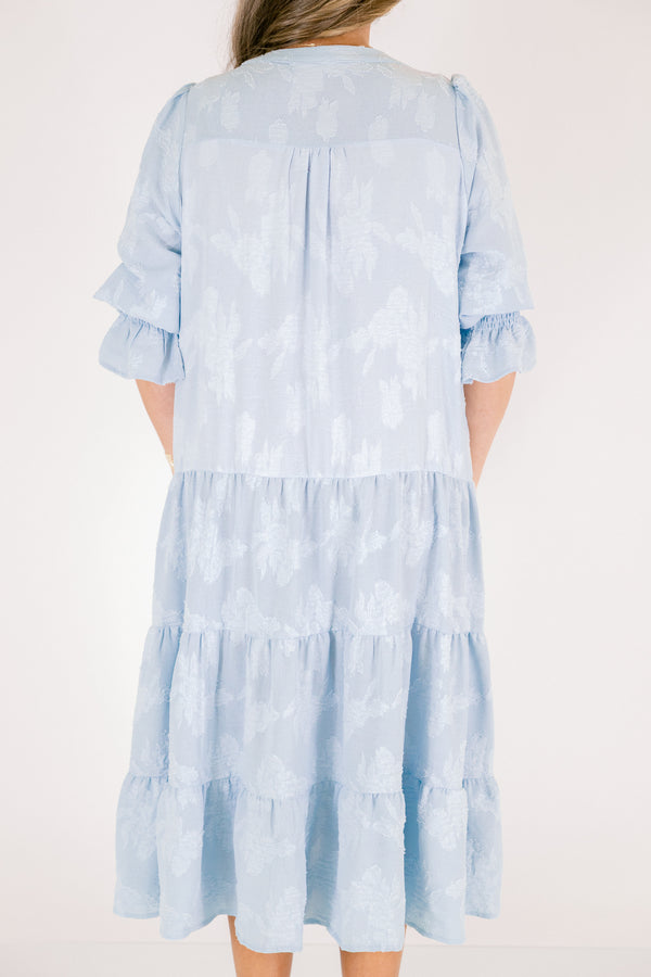 Chic Soul plus size clothing, baby blue tiered midi dress with half sleeves that that have a ruffle detail at the end of each sleeve as well a slight v-neckline and subtle floral pattern 