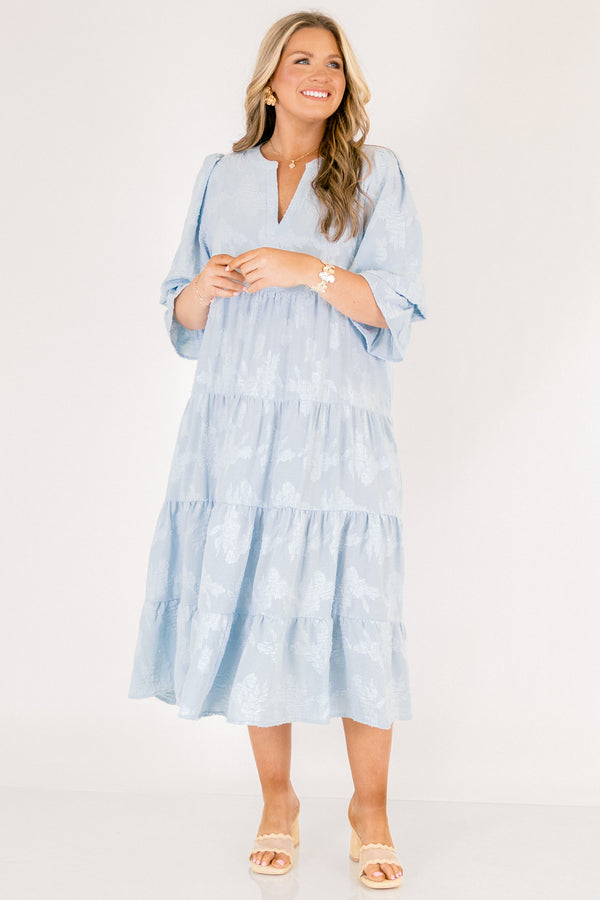 Chic Soul plus size clothing, baby blue tiered midi dress with half sleeves that that have a ruffle detail at the end of each sleeve as well a slight v-neckline and subtle floral pattern 