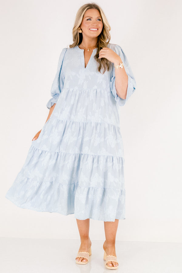 Chic Soul plus size clothing, baby blue tiered midi dress with half sleeves that that have a ruffle detail at the end of each sleeve as well a slight v-neckline and subtle floral pattern 
