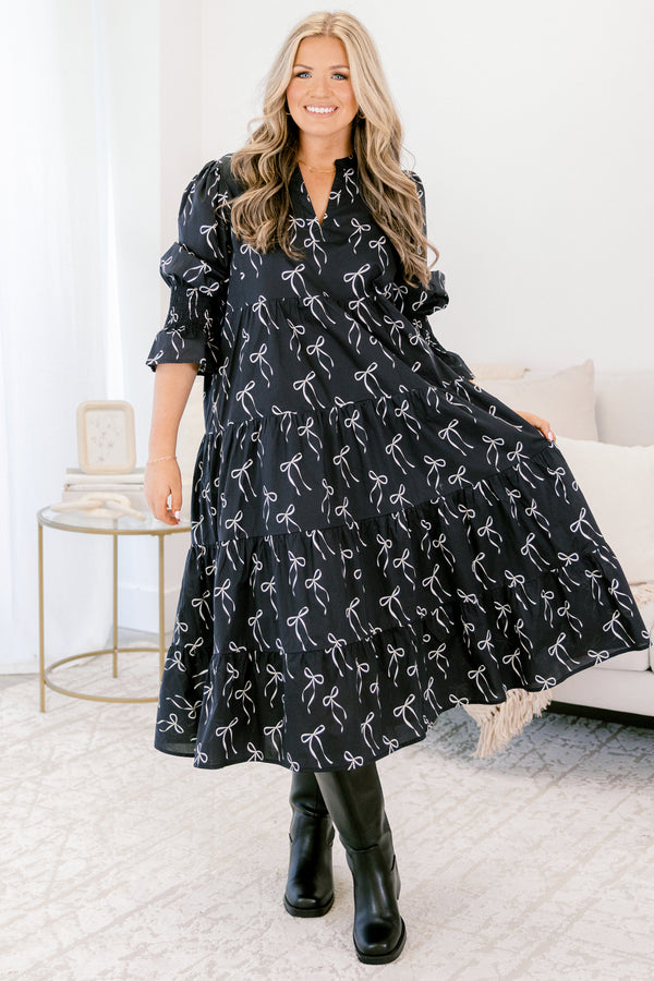 Chic Soul plus suze clothing, black midi dress with mid sleeves and v-neckline and white bow pattern