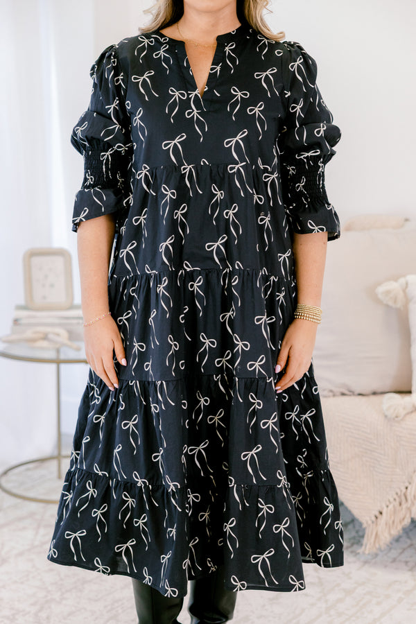 Chic Soul plus suze clothing, black midi dress with mid sleeves and v-neckline and white bow pattern