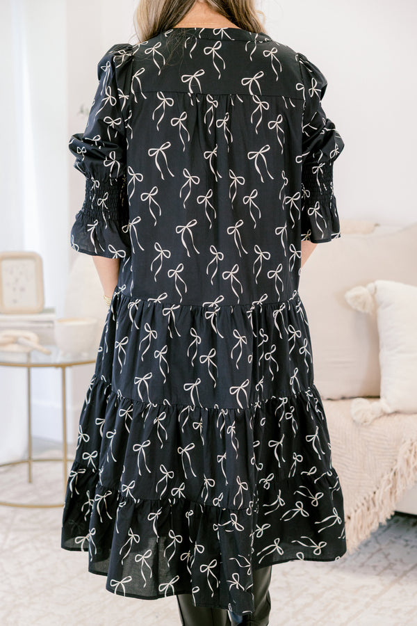 Chic Soul plus suze clothing, black midi dress with mid sleeves and v-neckline and white bow pattern