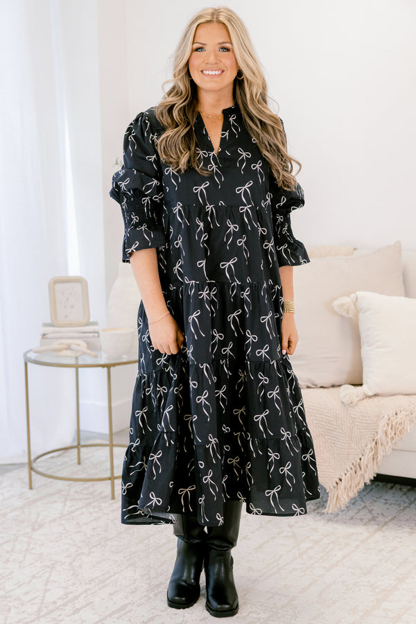 Chic Soul plus suze clothing, black midi dress with mid sleeves and v-neckline and white bow pattern