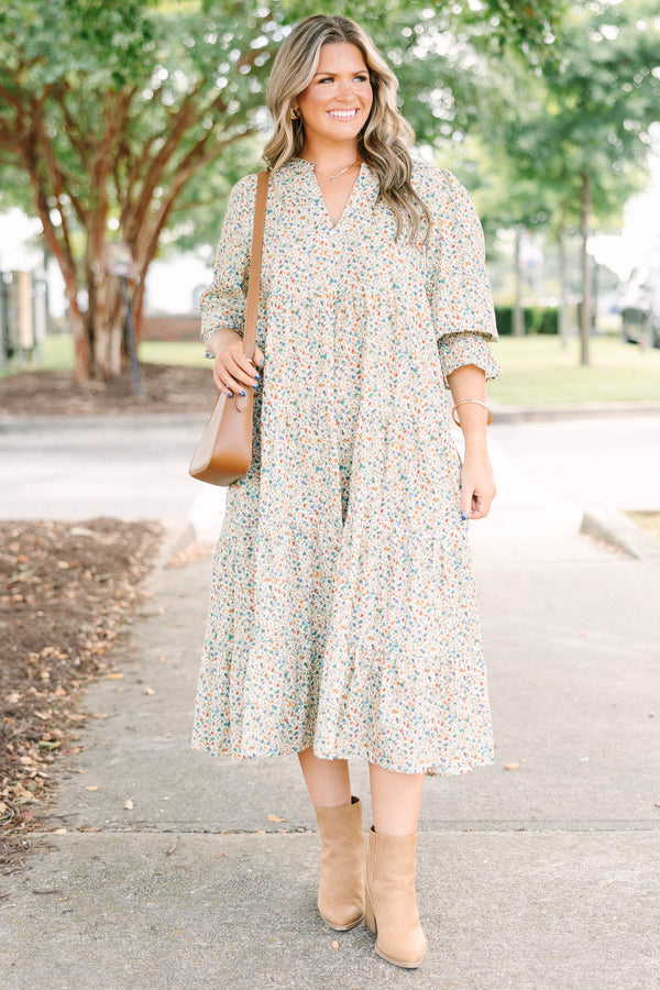Plus Size cream floral midi dress with a ditsy print, split v-neck, and smocked cuff sleeves.