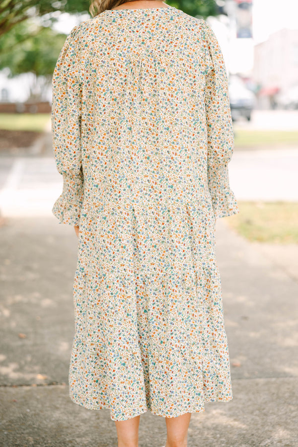 Plus Size cream floral midi dress with a ditsy print, split v-neck, and smocked cuff sleeves.