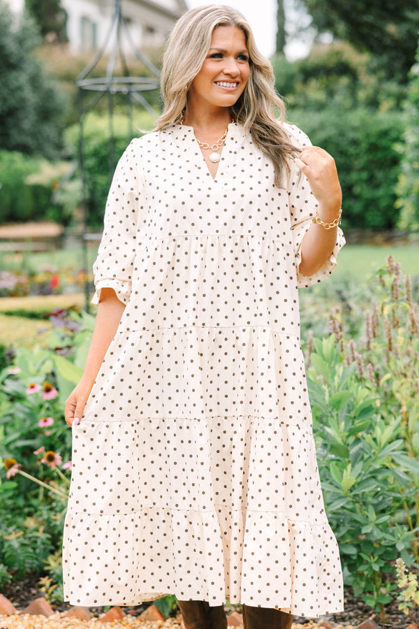 Plus Size cream tiered midi dress with brown polka dots, a V-neckline, and elbow-length sleeves.