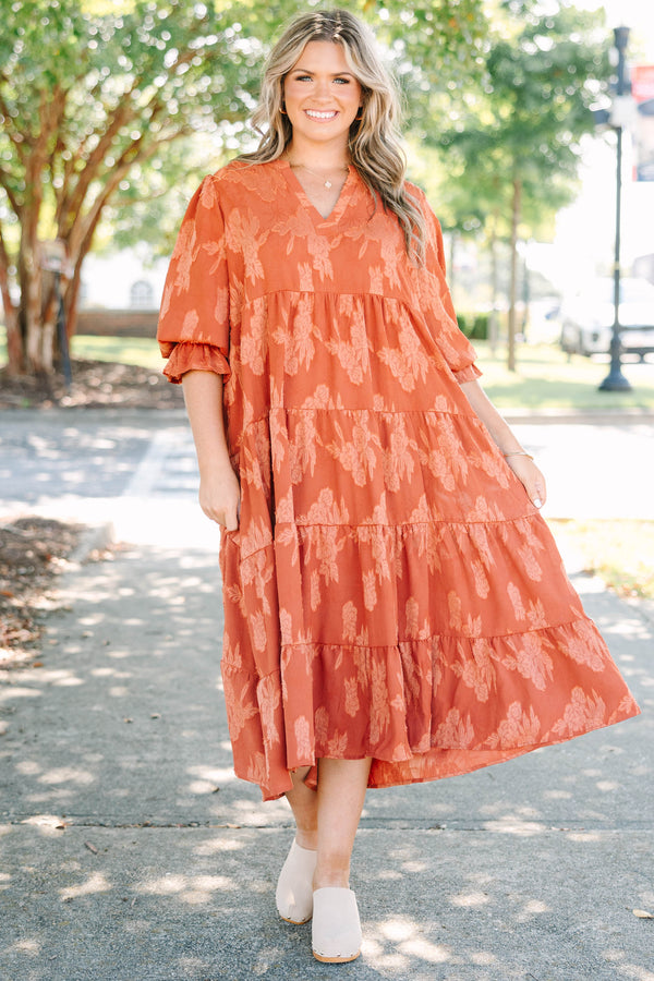 Plus Size orange tiered midi dress with a floral jacquard pattern, V-neckline, and 3/4 sleeves.