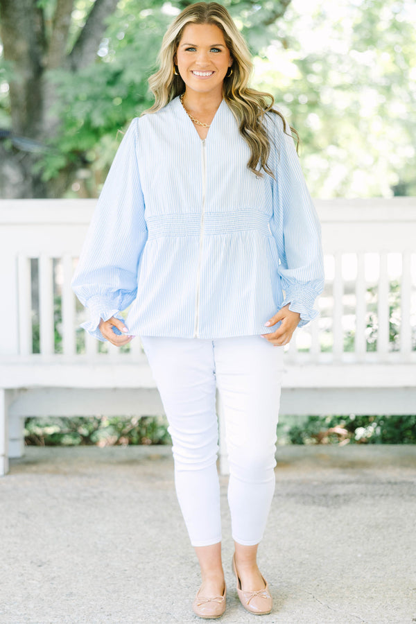 Plus Size light blue and white striped blouse with a zippered front and smocked waist.