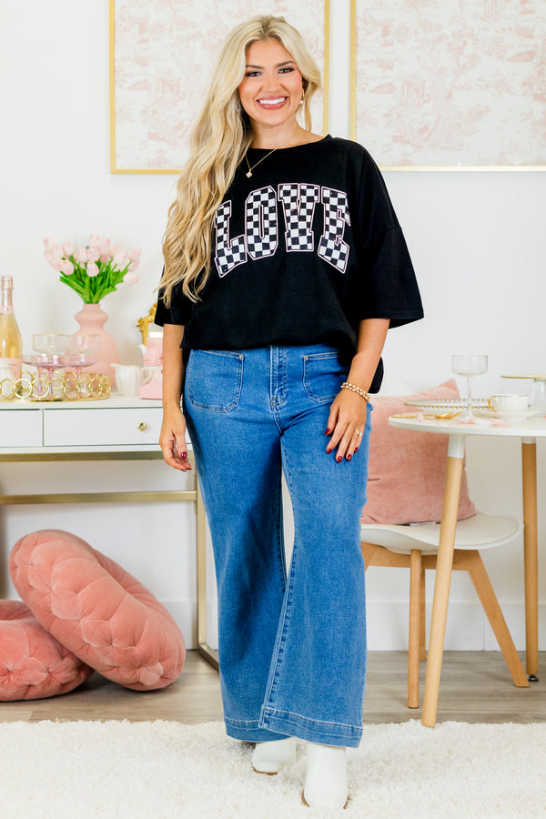 Chic Soul plus size clothing, short-sleeve black boyfriend tee with scoop-neckline with white and black checkered graphic lettering stating 