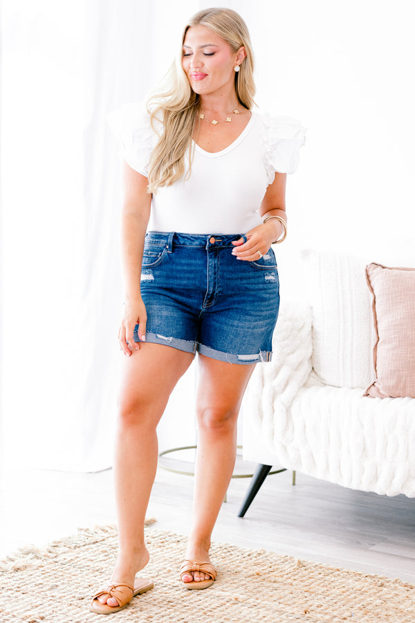 Chic Soul Plus size clothing, dark wash jean shorts with front pockets and a cuff at the bottom of each leg of the shorts