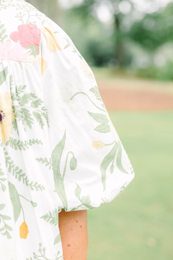 Plus Size cream button-down top with a floral print, puff sleeves, and a collared neckline.