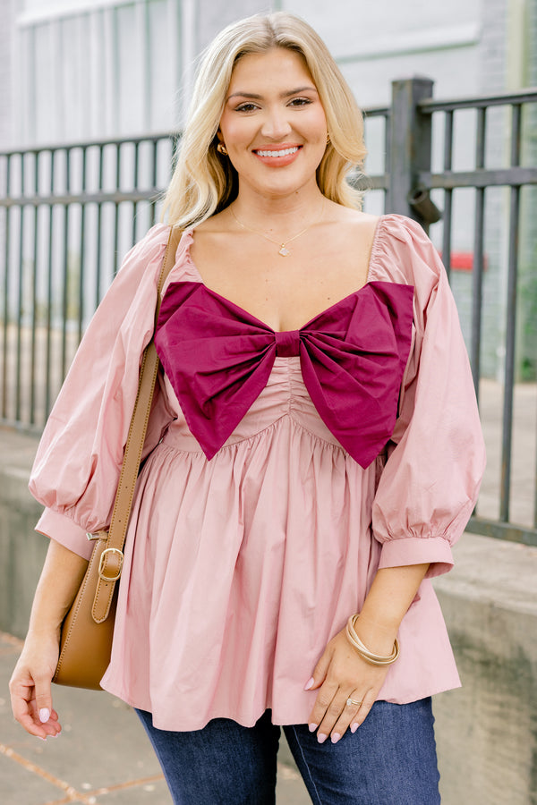 Chic Soul plus size clothing, light pink long sleeve babydoll top with an oversized maroon bow on the chest
