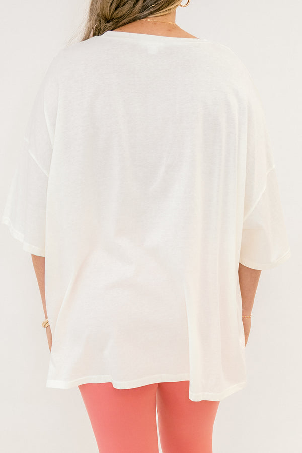 White blouse worn by a person with a plain background