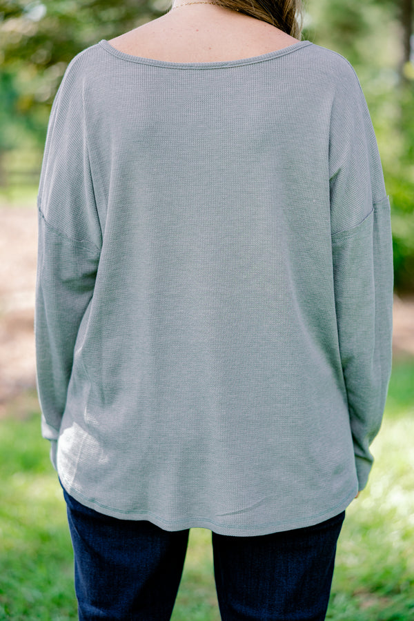 Chic Soul plus size clothing, light olive long sleeve top with scoop hem and buttons 1/4 of the way down the front