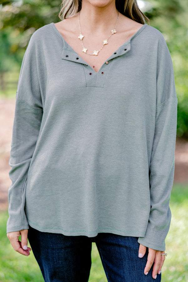 Chic Soul plus size clothing, light olive long sleeve top with scoop hem and buttons 1/4 of the way down the front